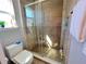 Stylish bathroom with tiled walk-in shower, updated fixtures, and natural light at 2926 Crest Wave Dr, Clermont, FL 34711