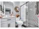 Chic bathroom with modern fixtures, patterned shower tiles, and stylish decor elements at 2926 Crest Wave Dr, Clermont, FL 34711
