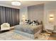 Inviting bedroom with a plush bed, decorative headboard, and stylish nightstands at 2926 Crest Wave Dr, Clermont, FL 34711