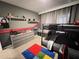 Inviting ' bedroom with bunk beds, carpeted floors, and grey accent wall at 2926 Crest Wave Dr, Clermont, FL 34711
