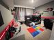 Charming ' bedroom with bunk beds, colorful Lego rug, and fun themed decor at 2926 Crest Wave Dr, Clermont, FL 34711
