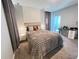 Serene bedroom with cozy bedding, soft lighting, and a soothing color palette at 2926 Crest Wave Dr, Clermont, FL 34711