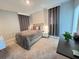 Cozy bedroom featuring plush bedding, soft lighting, and neutral decor at 2926 Crest Wave Dr, Clermont, FL 34711