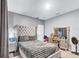 Comfortable bedroom with plush bedding, soft lighting, and serene decor, perfect for relaxation at 2926 Crest Wave Dr, Clermont, FL 34711