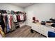 Well-organized closet featuring clothing racks, storage shelves and a white dresser at 2926 Crest Wave Dr, Clermont, FL 34711