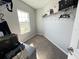 Small walk-in closet with neutral carpet and a window for natural light at 2926 Crest Wave Dr, Clermont, FL 34711