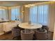 Elegant dining area featuring a modern table with seating for six and stylish lighting at 2926 Crest Wave Dr, Clermont, FL 34711