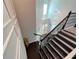 Grand foyer with hardwood floors, a soaring staircase with iron railings, and natural light at 2926 Crest Wave Dr, Clermont, FL 34711