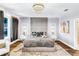 A stylish bedroom with paneled headboard, modern lighting, and soft textures for a cozy atmosphere at 2926 Crest Wave Dr, Clermont, FL 34711