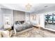 Stylish main bedroom featuring a plush bed, elegant lighting, and sophisticated decor at 2926 Crest Wave Dr, Clermont, FL 34711