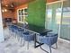 Inviting outdoor patio with dining area, summer kitchen, and lush greenery, ideal for entertaining at 2926 Crest Wave Dr, Clermont, FL 34711