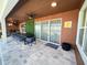 Covered outdoor patio with summer kitchen and dining area, perfect for enjoying outdoor meals and relaxing views at 2926 Crest Wave Dr, Clermont, FL 34711