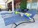 Comfortable patio with chaise lounges and stylish furniture, creating an inviting outdoor living space for relaxation and social gatherings at 2926 Crest Wave Dr, Clermont, FL 34711
