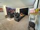 Home theater room features leather recliners, projector screen, and a popcorn machine at 2926 Crest Wave Dr, Clermont, FL 34711