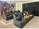 Home theater with leather recliners, a raised platform, and fun movie-themed decor at 2926 Crest Wave Dr, Clermont, FL 34711