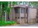 Inviting two-story home features a well-maintained yard and serene, woodsy surroundings at 5310 Pebble Beach Dr # 20, Orlando, FL 32811