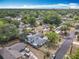 Overview of a neighborhood showcasing the house with mature trees, and ample yard space at 1104 E University Ave, Deland, FL 32724