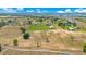 Sweeping aerial view of a property set amidst lush fields and a clear sky at 11630 Flynn Ct, Winter Garden, FL 34787