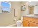 Bathroom featuring a vanity, toilet, and window with natural light and view at 11630 Flynn Ct, Winter Garden, FL 34787