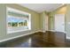 Cozy bedroom featuring hardwood floors, natural light, and neutral walls at 11630 Flynn Ct, Winter Garden, FL 34787