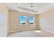 Bright bedroom features large windows, neutral walls, and ample space for personalization and comfort at 11630 Flynn Ct, Winter Garden, FL 34787