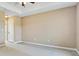 Neutral bedroom featuring a tray ceiling, neutral walls, and carpeted flooring at 11630 Flynn Ct, Winter Garden, FL 34787
