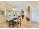 Cozy dining area with stylish lighting, a window view, and easy access to the kitchen and living spaces at 11630 Flynn Ct, Winter Garden, FL 34787