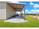 Exterior view of metal building with a covered area and rural surroundings at 11630 Flynn Ct, Winter Garden, FL 34787