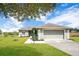 Charming single-story home showcasing a well-manicured lawn, a two car garage, and inviting curb appeal at 11630 Flynn Ct, Winter Garden, FL 34787