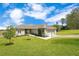 Charming single-story home features a well-manicured lawn, attractive landscaping, and a two-car garage at 11630 Flynn Ct, Winter Garden, FL 34787