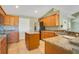 Well-equipped kitchen with granite countertops, center island, and stainless steel appliances at 11630 Flynn Ct, Winter Garden, FL 34787