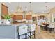 Modern kitchen with stainless steel appliances, pendant lighting, and a breakfast bar with stylish seating at 11630 Flynn Ct, Winter Garden, FL 34787