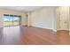 Expansive living area featuring hardwood floors, sliding doors and bright light at 11630 Flynn Ct, Winter Garden, FL 34787
