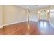 Bright living room featuring hardwood floors and a welcoming entrance with double doors and transom window at 11630 Flynn Ct, Winter Garden, FL 34787