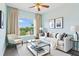 Airy living room with a window showcasing greenery and stylish furnishings at 11630 Flynn Ct, Winter Garden, FL 34787