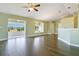 Open living area featuring hardwood floors and abundant natural light from windows at 11630 Flynn Ct, Winter Garden, FL 34787