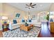 Comfortable living room features stylish furnishings, including a sectional sofa, patterned rug, and decorative accents at 11630 Flynn Ct, Winter Garden, FL 34787