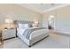 Relaxing main bedroom showcases a king-size bed, soft carpeting, and a serene ambiance for restful nights at 11630 Flynn Ct, Winter Garden, FL 34787