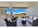 Comfortable screened patio with seating, a ceiling fan, and scenic views at 11630 Flynn Ct, Winter Garden, FL 34787
