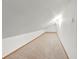 Finished attic features neutral carpeting, white walls, and ample lighting at 1220 Rolling Ln, Casselberry, FL 32707
