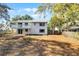 Exterior view showcasing the backyard, deck and fence at 1220 Rolling Ln, Casselberry, FL 32707