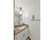 Bathroom featuring granite counters, a vanity, and white walls at 1220 Rolling Ln, Casselberry, FL 32707