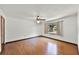 Bedroom with laminate wood flooring, ceiling fan, and window at 1220 Rolling Ln, Casselberry, FL 32707