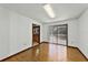 Empty room with a ceiling light fixture and a sliding glass door leading to the backyard at 1220 Rolling Ln, Casselberry, FL 32707