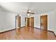 Spacious bedroom with hardwood floors, ceiling fan, and ample closet space at 1220 Rolling Ln, Casselberry, FL 32707