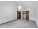 Spacious bedroom with neutral carpet, walk-in closet, and access to additional rooms at 1220 Rolling Ln, Casselberry, FL 32707