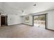 Bright living room with large windows and sliding glass door leading to the outside at 1220 Rolling Ln, Casselberry, FL 32707