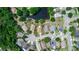 A neighborhood view featuring the home in a wooded surrounding, and highlighting the lot boundaries at 13624 Springtide Ct, Orlando, FL 32826