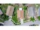 A high-angle view showcases the roof, landscaping, and surrounding neighborhood at 13624 Springtide Ct, Orlando, FL 32826