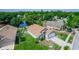 Beautiful aerial view of the home with its well-maintained lawn and serene water views at 13624 Springtide Ct, Orlando, FL 32826